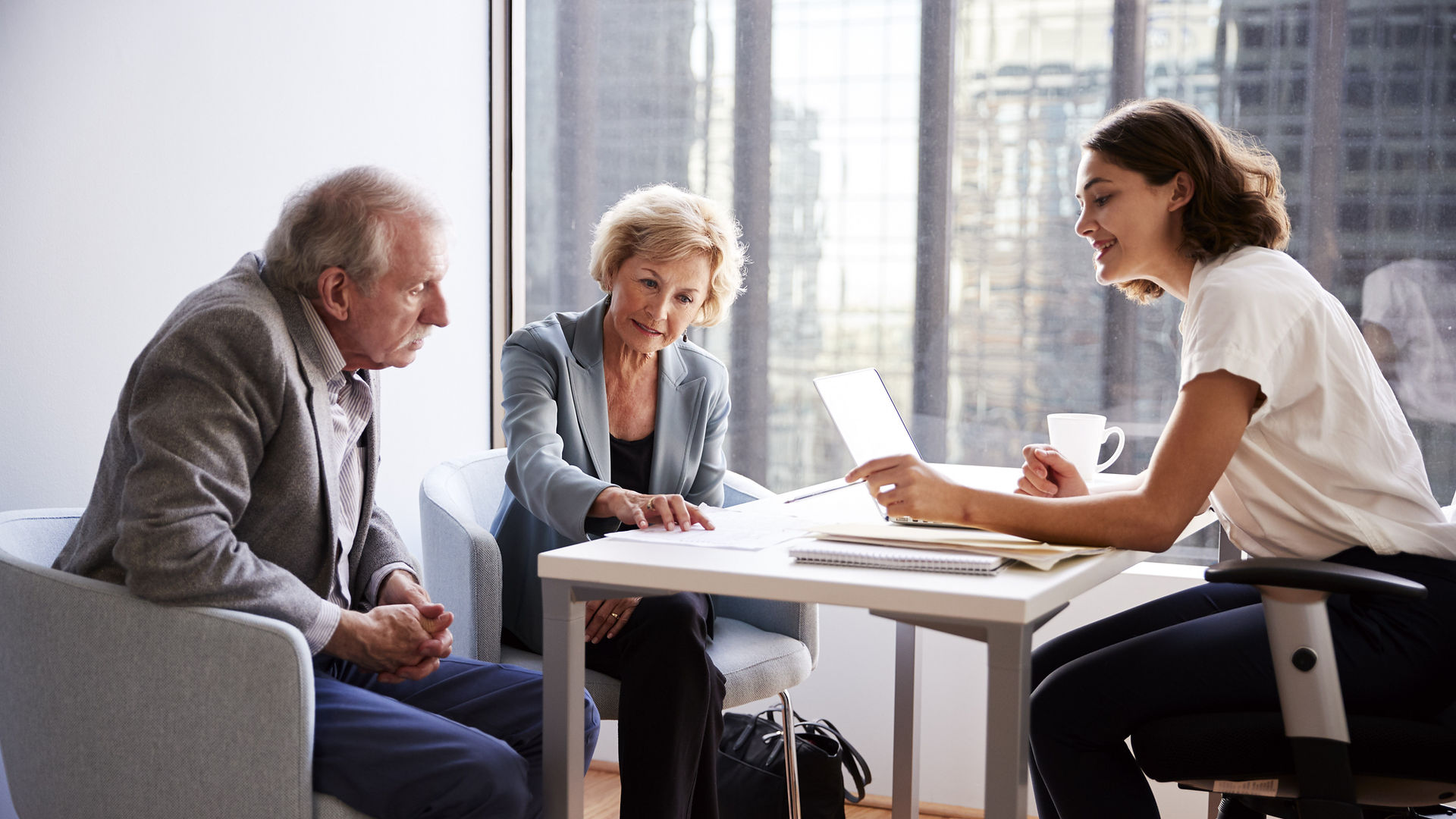 Couple Sitting with Financial Advisor