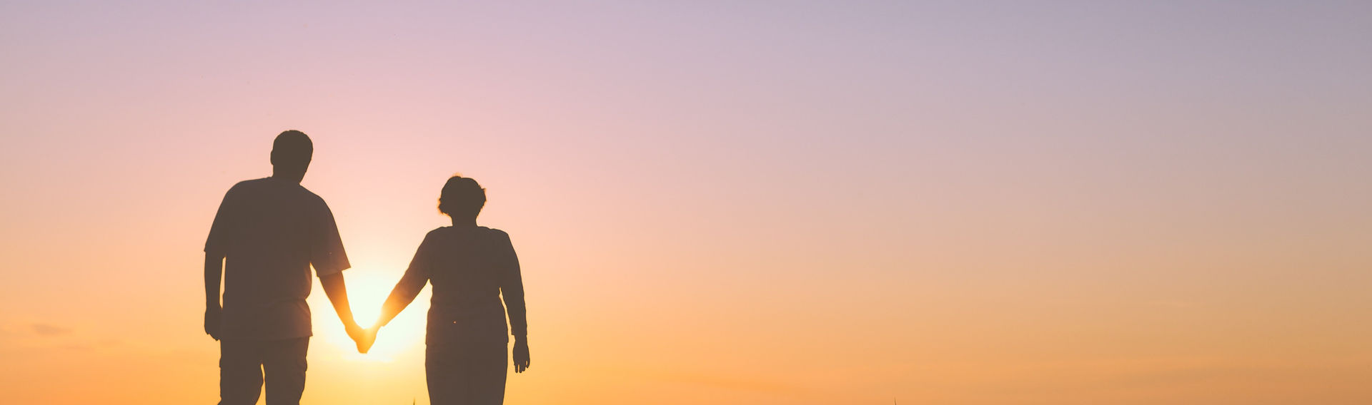 Retired Couple Walking - Sunset