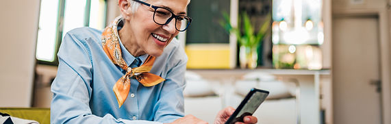 Retiree on phone learning about taxes and investments